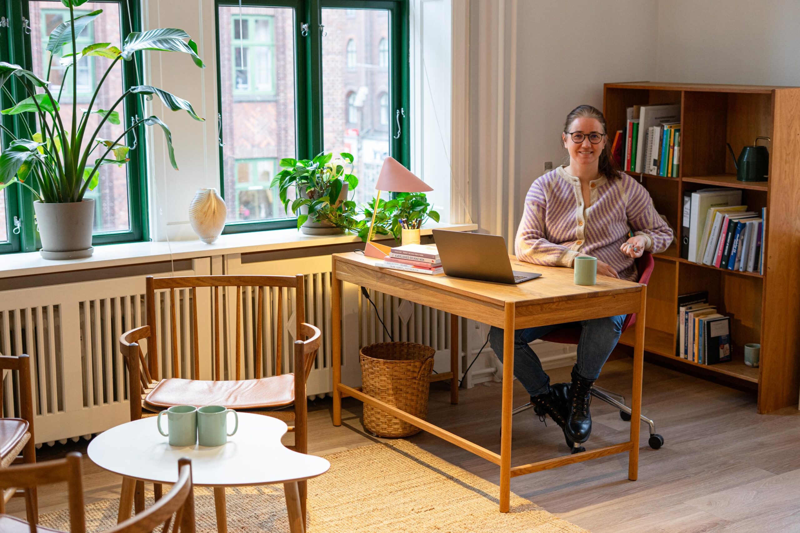 Psychologist Marlene Lyby at her desk in the bright clinic